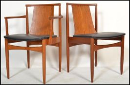 A pair of mid century Danish Influence teak wood dining chairs in the manner of EON ( Elliotts of