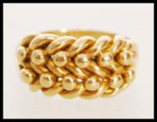 A 20th century hallmarked 18ct gold ring with a knotted design head. Hallmarked Chester. Weight 7.
