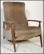 A vintage retro 20th century Danish influence teak reclining armchair having shaped arm rests with