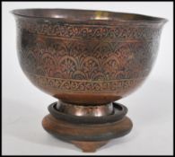 An 18th century Persian Islamic Middle Eastern prayer bowl constructed from two joined pieces of