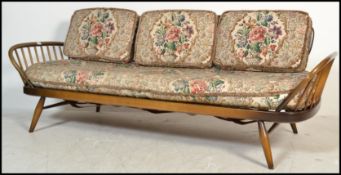 An original Ercol 1970's day bed sofa settee complete with cushions in good order. Mid dark colour