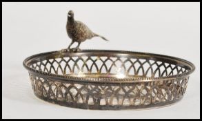 A silver early 20th century bon bon / centre dish having fret pierced lattice worked sides adorned