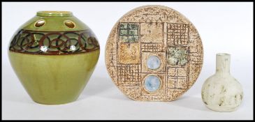 A group of vintage studio pottery to include a Fosters Wheel vase , a Carn Penzance pottery baluster