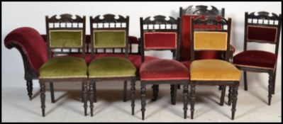 A Victorian mahogany salon suite comprising a chaise longue, dining chairs, gents library armchair