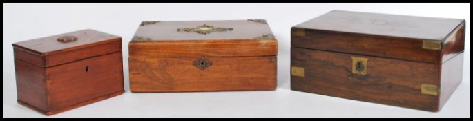 A 19th century Georgian walnut and brass bound writing slope having appointed interior set within