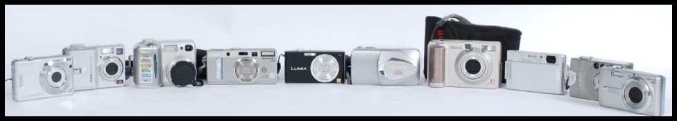 A collection of digital cameras to include a Canon Power Shot A20 2.1 mega pixels, a Nikon cool