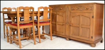 A 1930's Art Deco oak dining room suite comprising a light oak draw leaf refectory dining table ,