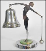 A vintage early 20th century Art Deco car mascot type bell having a maiden / spirit of ecstasy