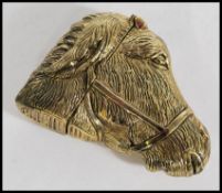 A 20th century brass vesta case in the form of a donkey.  Measures 6 cm wide.