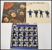 A collection of 3 Beatles LP's ( records ) to include ' A Hard Days Night ', ' Help! ' and '