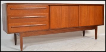 A mid century / 1960's period White & Newton teak wood sideboard credenza. The sideboard with a bank