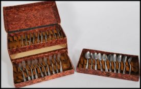 An early 20th Century German Aluminium child's / doll cutlery canteen consisting of knives, forks