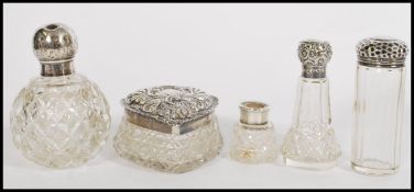 A collection of silver hallmarked and cut glass ladies vanity wares. To include perfume bottles,