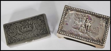 A silver hallmarked Victorian matchbox holder, the top in relief depicting a courting couple, raised