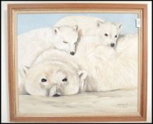 A framed oil painting of polar bears in including mother and cub, signed to the corner Simon May.