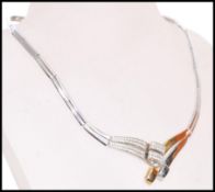 A 20th century 14ct white and yellow gold collar necklace. Weight approx 32.7g. Diameter 14cm.
