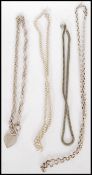 A selection of silver necklace chains to include a heart clasp necklace and herringbone chain. Total