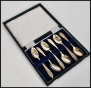 A set of six silver hallmarked large tea spoons having chased decoration by John Round & Son Ltd (
