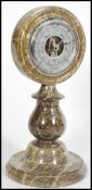 A 20th century grey marble British made desktop/ table Shortland barometer, having a round face with