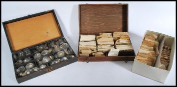 A selection of 20th century watch glasses to include a wooden boxed selection of glasses labelled 25