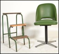 A vintage 20th century retro green leather bucket seat spinning raised on a metal column with on