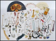 A collection of vintage 20th century costume jewellery to include a stamped sterling silver locket