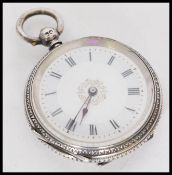 A early 20th century hallmarked British silver ladies pocket watch with roman numerals to the