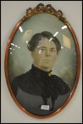 A Victorian oval convex glass watercolour portrait study of a lady in period dress set in gilt frame