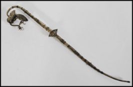 A vintage early 20th century silver white metal Indian opium pipe of large form having rope work and