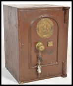 A Victorian cast iron painted safe of rectangular form with brass makers plaque to the front for