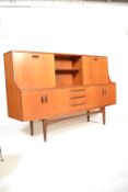 A 1970's G-Plan highboard sideboard in the Sienna pattern. Raised on tapering legs with a series