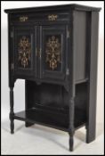 A late 19th / early 20th Century aesthetic movementebonised cabinet with applied gilt detailing,