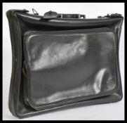 A retro 20th Century leather leather gentleman's suit carrier with shoulder strap, applied Dunhill