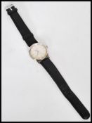 A vintage Omega Seamaster stainless steel watch having a champagne dial with silver baton numerals