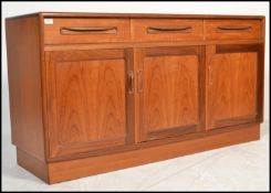 A vintage mid century G-Plan teak long and low sideboard in the Fresco design comprising of cupboard