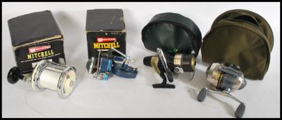 A collection of fishing reels to include a Garcia Mitchell Model 624, Garcia Mitchell Match,