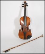 An early 20th Century Edwardian Violin, with retailers label reading Supplied by W. Thompson, 33