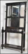 A Victorian 19th century Jacobean revival ebonised oak hall stand ( hallstand ). Raised on bobbin