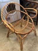 A vintage mid 20th century bamboo fan back ' tropics ' lattice work armchair of angular shaped form.