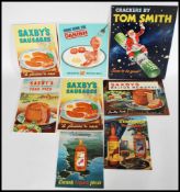 A selection of vintage 20th century cardboard backed point of sale counter top easel back display