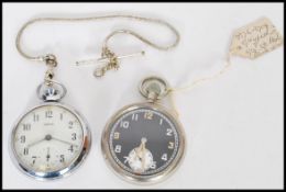 A nickel silver 1940's  black faced military pocket watch having Jaeger style hands, marked with