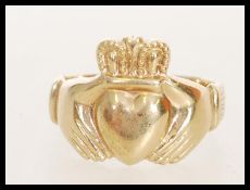 A hallmarked 9ct gold Claddagh ring. Weight 5.3g. Size P.