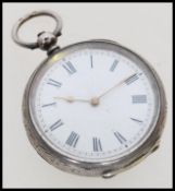 A 20th century silver hallmarked pocket watch with embossed decoration to the case, having a white