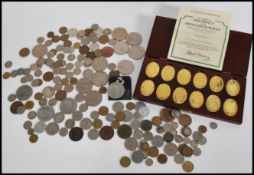 A selection of commemorative coins to include The Arms of the Prince and Princess of Wales Ingots