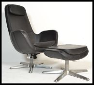 A contemporary black leather swivel reclining easy / lounge chair together with matching