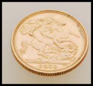A year 2000 Queen Elizabeth II gold sovereign with the George and the Dragon design.