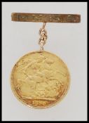 A Victorian gold full sovereign having brooch pin engraved M.M. S.A. Date 1890. Total weight 9.3g