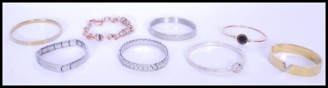 A collection of contemporary designer costume jewellery bangles and bracelets, to include a Marc