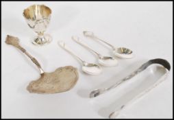 A collection of silver hallmarked items to include a Birmingham hallmarked egg cup, Sheffield and