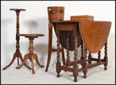 A collection of items to include a 1920's oak barrel planter with brass bindings together with a